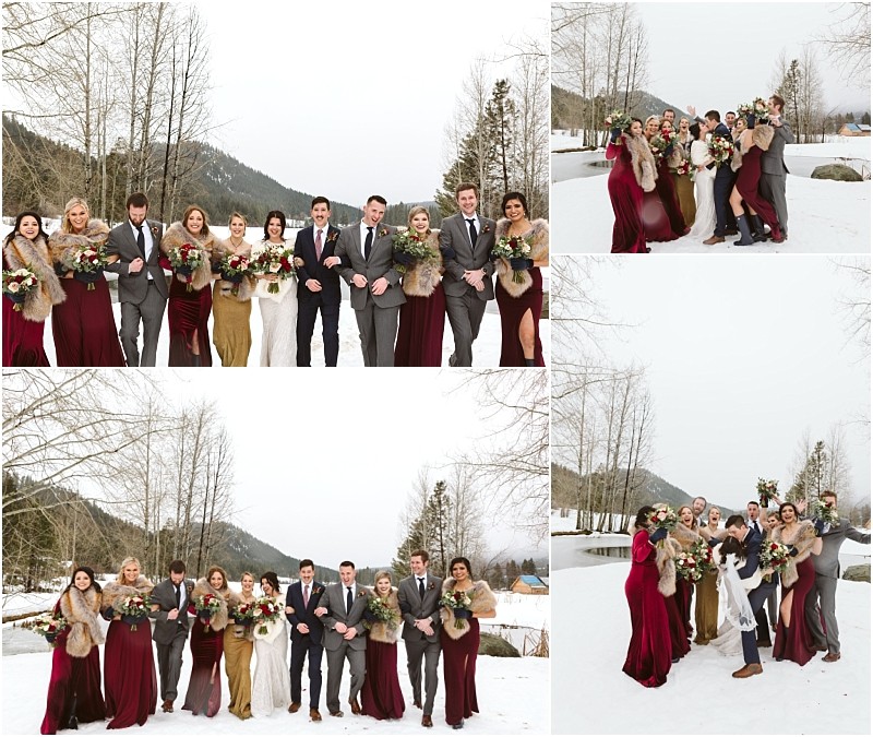 Snohomish & seattle wedding photographer | gsquared weddings photography a joyful leavenworth wedding party poses outdoors on snow with mountains and bare trees behind them The group in formal attirewomen in burgundy and gold dresses men in gray suitsholds bouquets and smiles brightly | wedding photo by gsquared weddings