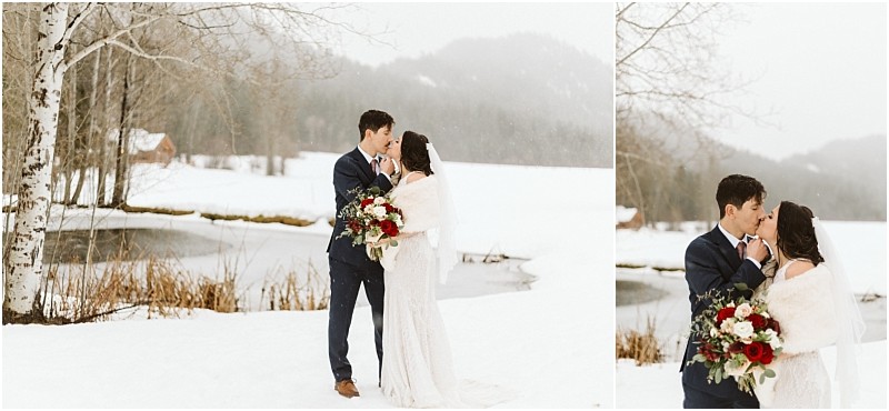 Snohomish & seattle wedding photographer | gsquared weddings photography a bride and groom stand in the snow by a pond holding a bouquet of red and white flowers They gaze at each other lovingly during their leavenworth wedding surrounded by snowy trees and distant mountains on a wintry day | wedding photo by gsquared weddings