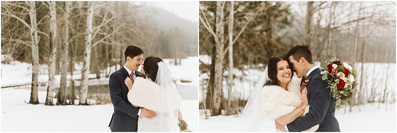 Snohomish & seattle wedding photographer | gsquared weddings photography a bride and groom embrace outdoors in a snowy leavenworth wedding The bride wears a white dress veil and fur shawl while the groom is in a navy suit holding red and white flowers amid bare trees and snow | wedding photo by gsquared weddings