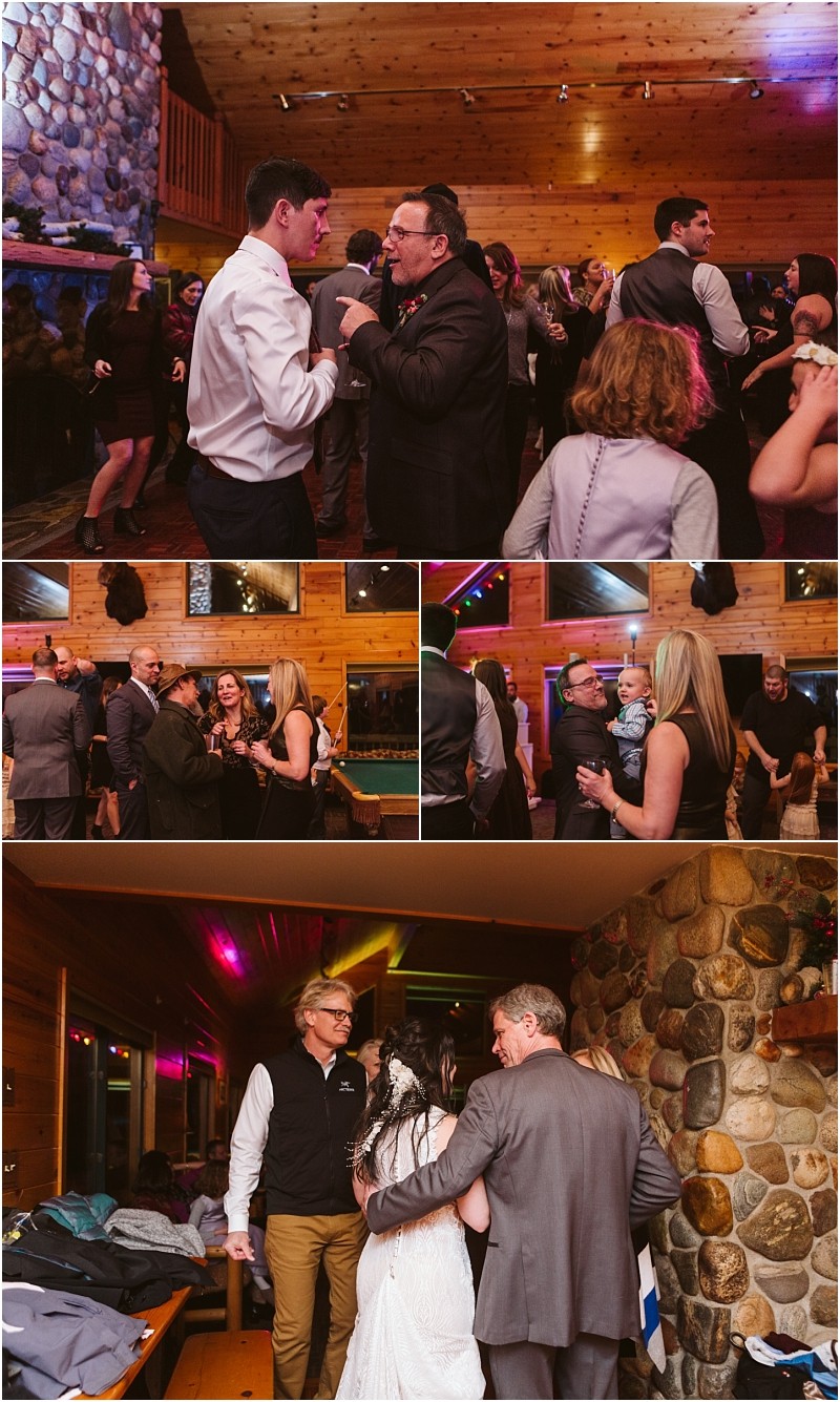 Snohomish & seattle wedding photographer | gsquared weddings photography a group of people celebrate indoors at a rustic venue with wood paneled walls and stone accents dancing talking and enjoying a festive leavenworth wedding reception | wedding photo by gsquared weddings