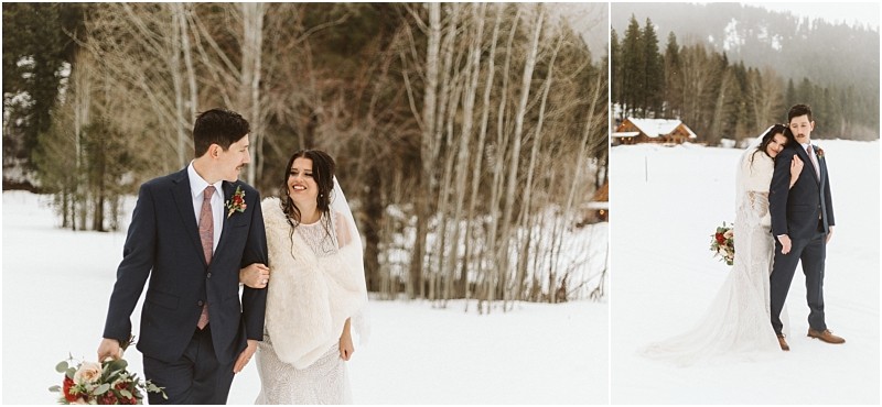 Snohomish & seattle wedding photographer | gsquared weddings photography a bride and groom walk through a snowy leavenworth wedding landscape smiling at each other The bride wears a white dress and shawl with a bouquet the groom dons a blue suit and red boutonniere Snowy trees and cozy cabins complete the scene | wedding photo by gsquared weddings