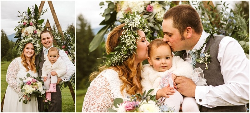 Snohomish & seattle wedding photographer | gsquared weddings photography a bride and groom both smiling pose outdoors with their young child at their machias elopement The brides flower crown and lace dress add charm as they sit by floral decorations among the treeslove with a view beneath the open sky | wedding photo by gsquared weddings