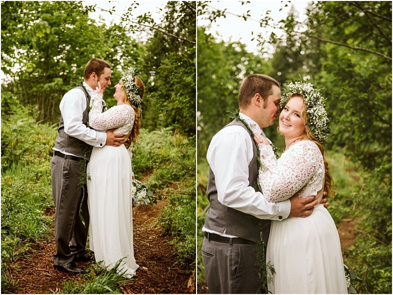 Snohomish & seattle wedding photographer | gsquared weddings photography a bride and groom stand on a wooded path embracing and smiling at each other during their machias elopement Surrounded by lush greenery they share love with a viewthe bride in lace and floral crown the groom in vest and tie | wedding photo by gsquared weddings