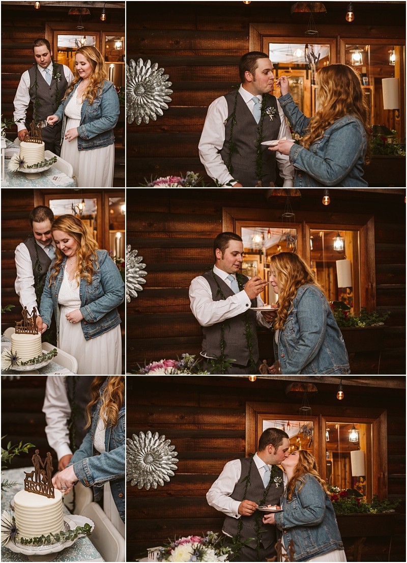 Snohomish & seattle wedding photographer | gsquared weddings photography a couple in wedding attire the woman in a white dress and denim jacket the man in a vest and tie laugh and share cake at their machias elopement feeding each other inside a warmly lit rustic venuelove with a view all around | wedding photo by gsquared weddings