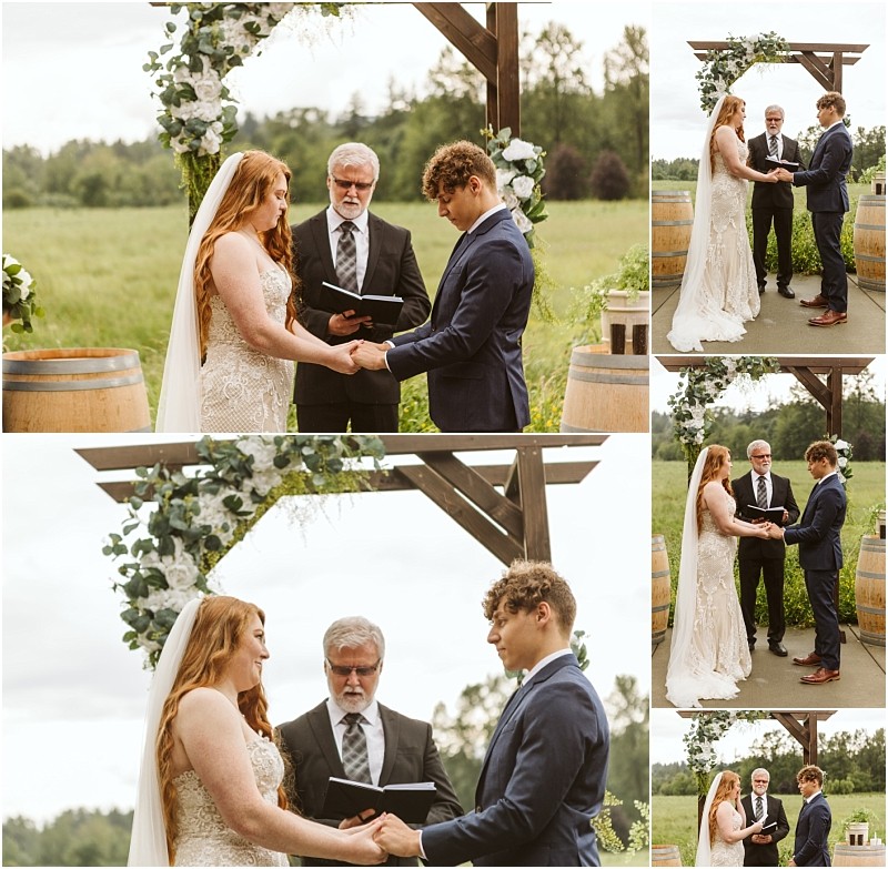 Snohomish & seattle wedding photographer | gsquared weddings photography a bride and groom stand holding hands under a wooden arch decorated with flowers during their marionfield farm elopement as an officiant reads from a book Trees and fields provide the perfect backdrop for this outdoor wedding ceremony | wedding photo by gsquared weddings