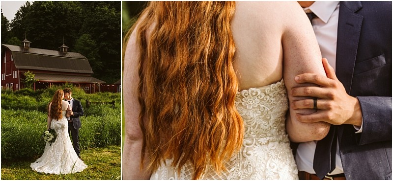 Snohomish & seattle wedding photographer | gsquared weddings photography a couple stands in a green field near a red barn at their marionfield farm elopement the bride in a lace dress with long red hair and the groom in a suit holds her arm gently | wedding photo by gsquared weddings