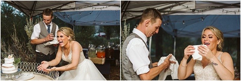Snohomish & seattle wedding photographer | gsquared weddings photography a bride and groom laugh while sharing cake at their methow elopement The bride wipes her face with a napkin as the groom offers her another both smiling and enjoying the playful moment under a tent | wedding photo by gsquared weddings
