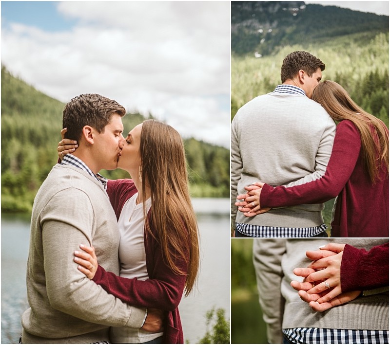 Snohomish & seattle wedding photographer | gsquared weddings photography a couple embraces and kisses outdoors near gold creek pond with forested mountains in the background One close up shows the womans hand with an engagement ring resting on the mans back capturing their engagement moment | wedding photo by gsquared weddings