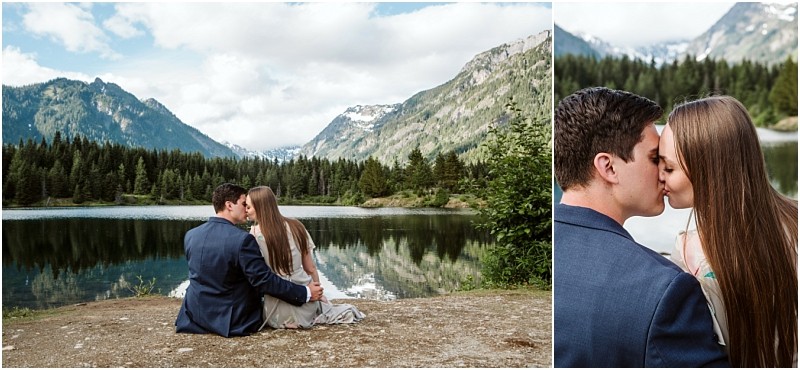 Snohomish & seattle wedding photographer | gsquared weddings photography a couple sits by gold creek pond surrounded by pine trees and snow capped peaks holding each other and sharing a kiss The water reflects the scenic landscape on this romantic engagement day under a partly cloudy sky | wedding photo by gsquared weddings