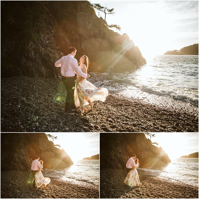 Snohomish & seattle wedding photographer | gsquared weddings photography a couple stands on a rocky beach at sunset during their deception pass engagement session in june 2020 embracing and dancing as waves gently come ashore her dress flowing in the breeze amid golden sunlight and scenic cliffs | wedding photo by gsquared weddings