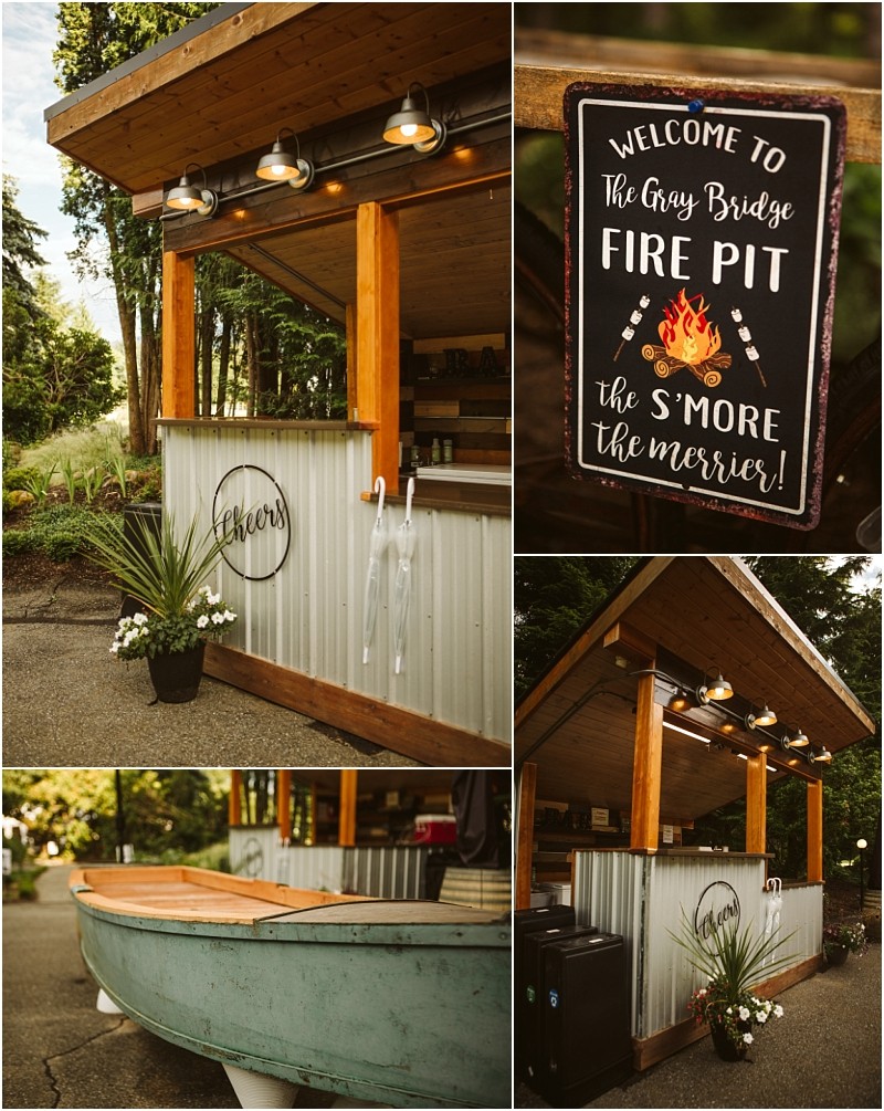 Snohomish & seattle wedding photographer | gsquared weddings photography a rustic outdoor bar with corrugated metal and wood accents decorated with plants A sign reads welcome to gray bridge fire pit the smore the merrier  nearby a rowboat repurposed as decor adds charm to gray bridge | wedding photo by gsquared weddings