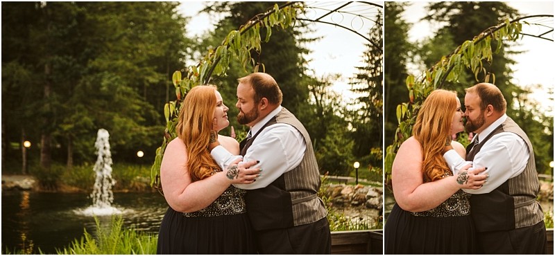 Snohomish & seattle wedding photographer | gsquared weddings photography a couple embraces and gazes at each other lovingly near a garden pond with a fountain surrounded by greenery and trees beneath an arched trellis at their gray bridge engagement | wedding photo by gsquared weddings