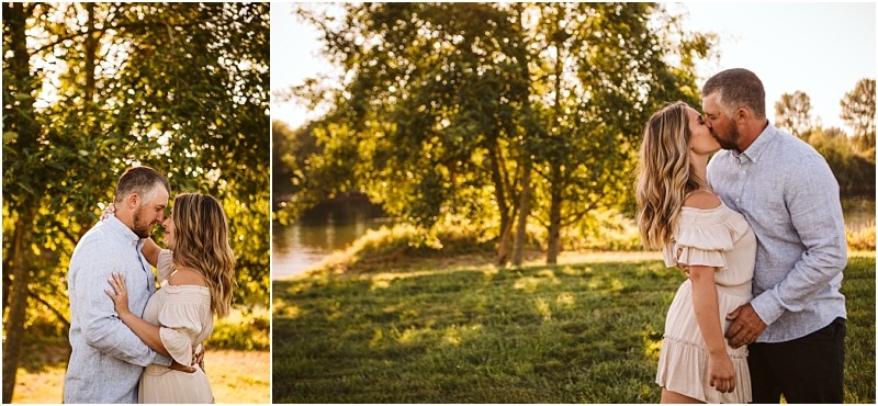 Snohomish & seattle wedding photographer | gsquared weddings photography a couple stands outdoors in a sunlit grassy area by a river at pemberton farm in snohomish embracing and sharing a kiss Both are dressed in light casual summer clothing surrounded by trees and golden evening light | wedding photo by gsquared weddings