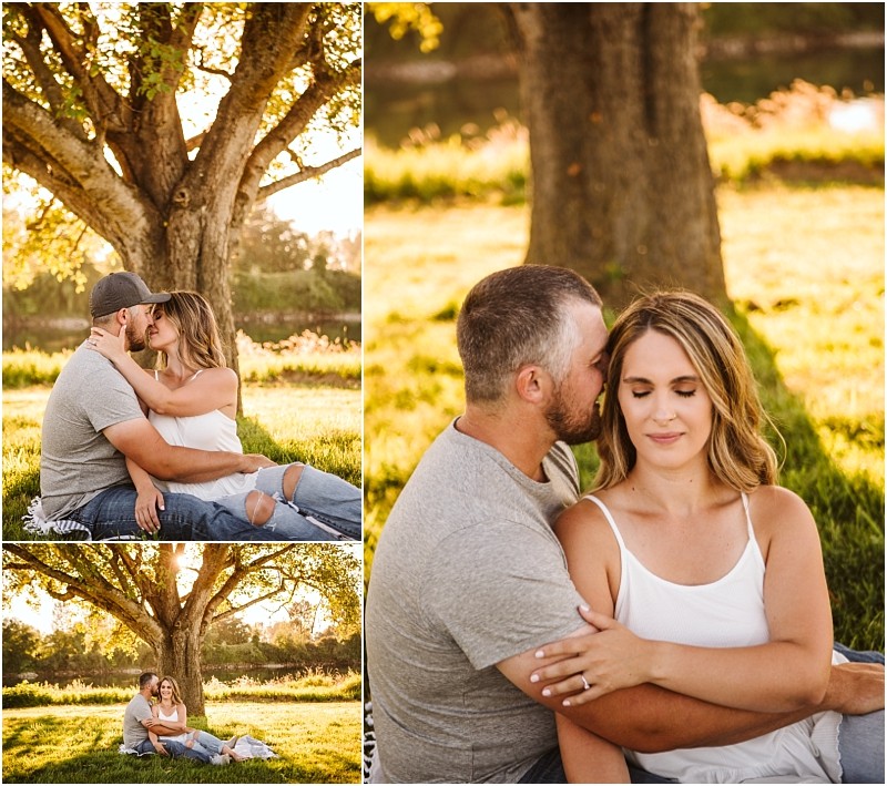 Snohomish & seattle wedding photographer | gsquared weddings photography a couple sits on the grass under a large tree at pemberton farm in snohomish embracing and sharing a kiss in warm sunlight Close up and wide shots capture their affection in this peaceful outdoor engagement setting | wedding photo by gsquared weddings