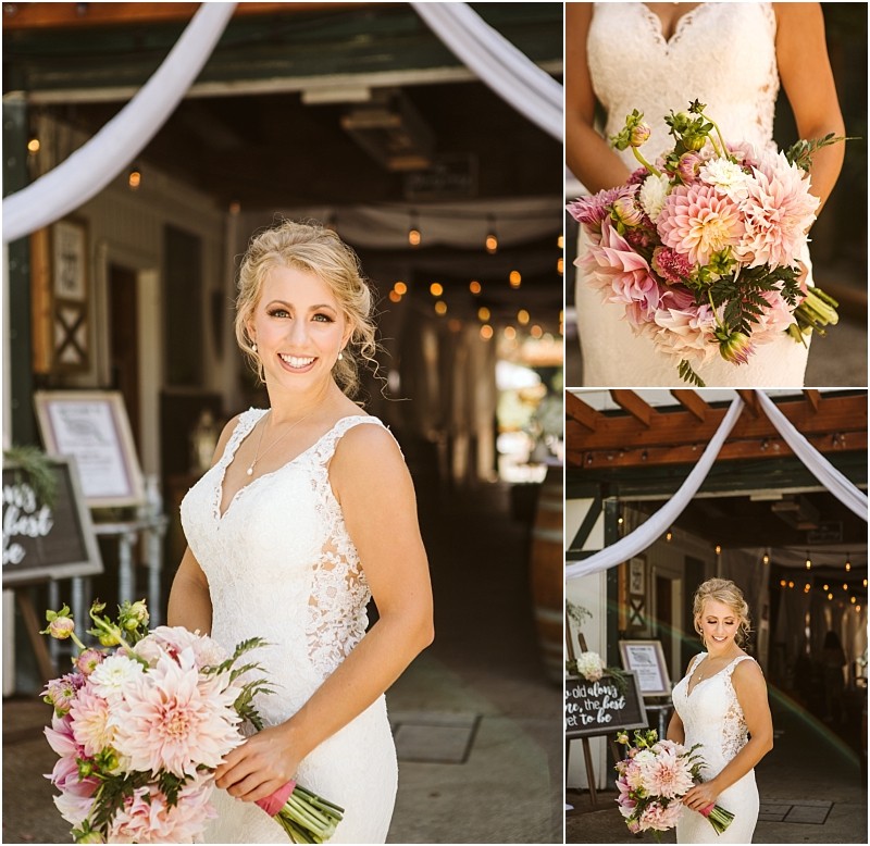 A smiling bride in a lace white gown holds a bouquet of pink and white flowers She poses outdoors in snohomish under draped fabric with wedding signage and string lights in the background Close ups show her bouquet and dress details Snohomish wedding photography
