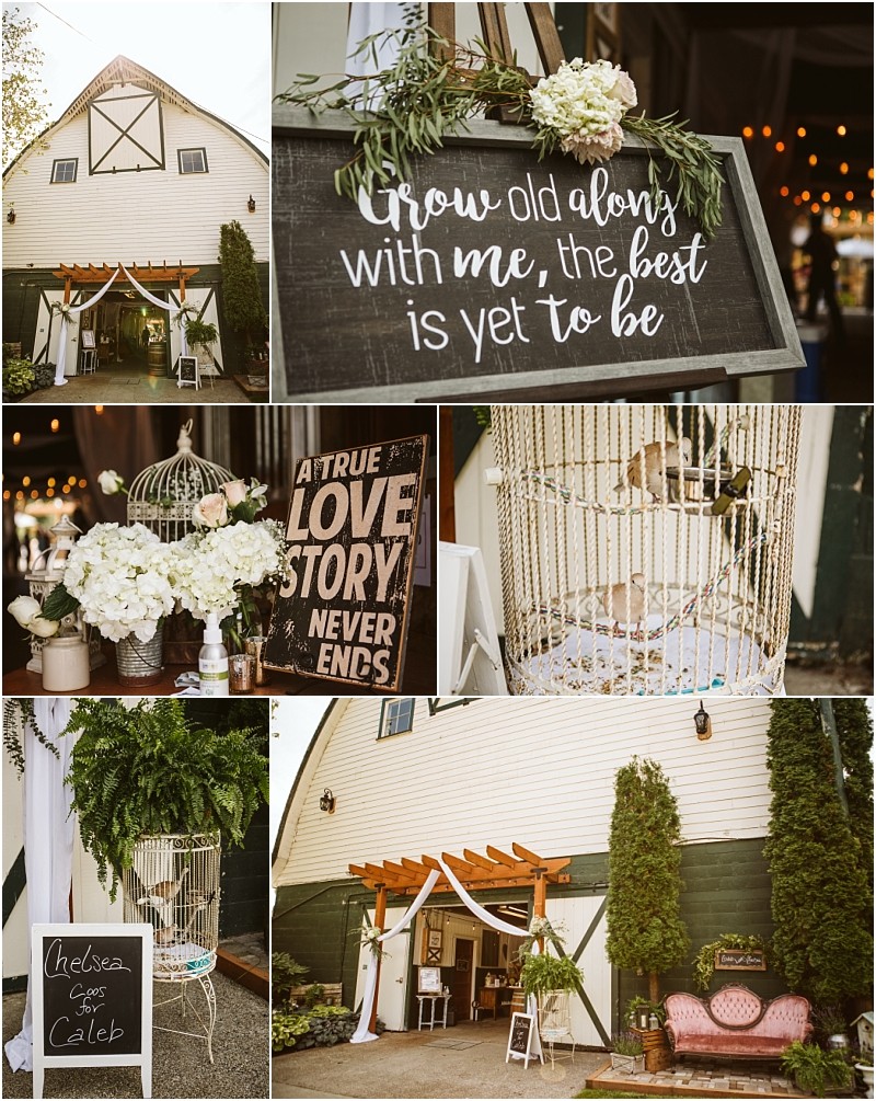 A rustic snohomish barn wedding setup with floral arrangements a sign reading grow old along with me the best is yet to be a birdcage filled with flowers another sign saying a true love story never ends and welcoming decor Snohomish wedding photography