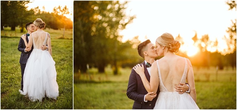 A couple dressed in wedding attire embraces and kisses in a sunlit snohomish field with the bride in a white gown and the groom in a dark suit Trees and a warm sunset create a romantic natural backdrop Snohomish wedding photography