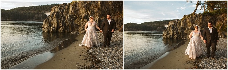 A bride and groom walk hand in hand along a rocky snohomish beach at sunset with cliffs and calm water in the background Both are smiling and dressed in wedding attire Snohomish wedding photography