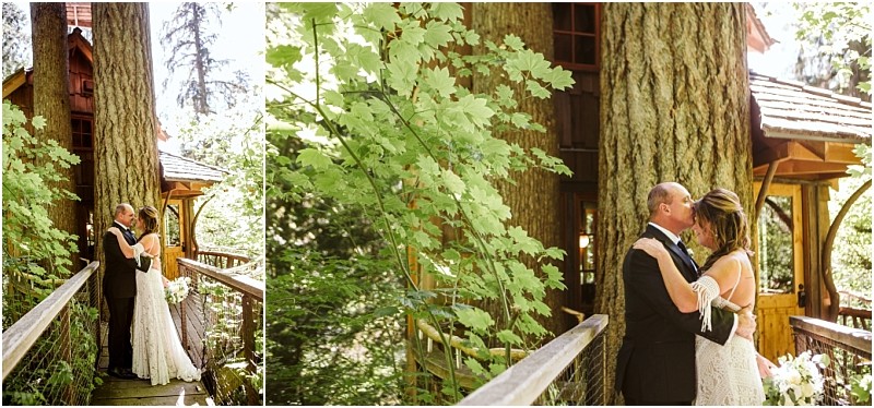 A bride and groom embrace and kiss by a large tree next to a rustic wooden treehouse in snohomish surrounded by lush green foliage on a sunny day Snohomish wedding photography