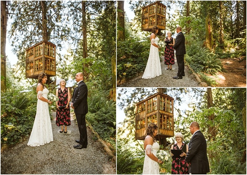 Bride and groom stand with an officiant during an outdoor snohomish forest wedding ceremony with a large wooden birdhouse structure in the background All are dressed formally surrounded by tall trees and lush greenery Snohomish wedding photography