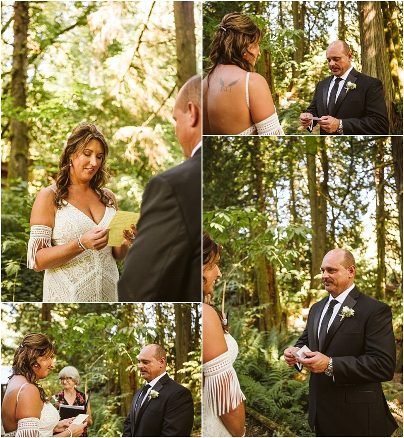 A woman in a white dress and a man in a black suit exchange vows and rings during a stunning snohomish wedding ceremony surrounded by trees and lush forest greenery Snohomish wedding photography