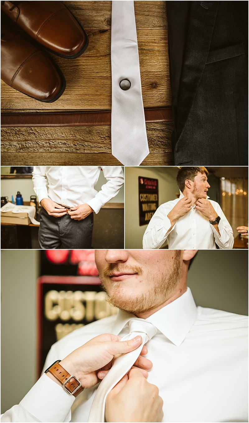 A man gets ready in snohomish putting on dress pants a white shirt and a white tie Close ups show brown shoes a neatly folded tie and hands adjusting his tie in front of a sign in the background Snohomish wedding photography