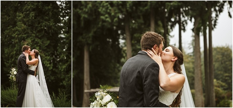 A bride and groom share a romantic kiss outdoors in snohomish surrounded by tall trees The bride holds a bouquet and wears a white dress with a veil while the groom wears a dark suit Snohomish wedding photography