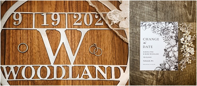 Close up of wedding rings on a wooden sign with woodland and 9 19 2021 details next to a floral change the date card for a snohomish wa wedding displayed on a rustic wood background Snohomish wedding photography
