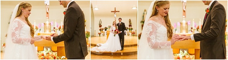 A bride and groom exchange rings and stand together at the altar in a snohomish church during their wedding ceremony surrounded by flowers and religious symbols Snohomish wedding photography