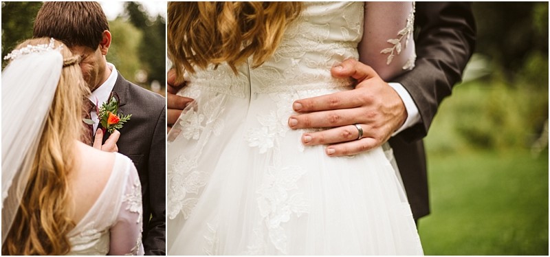 A bride and groom embrace outdoors in snohomish a close up shows the grooms hand on the brides waist both in wedding attire highlighting lace details and the grooms wedding ring Snohomish wedding photography