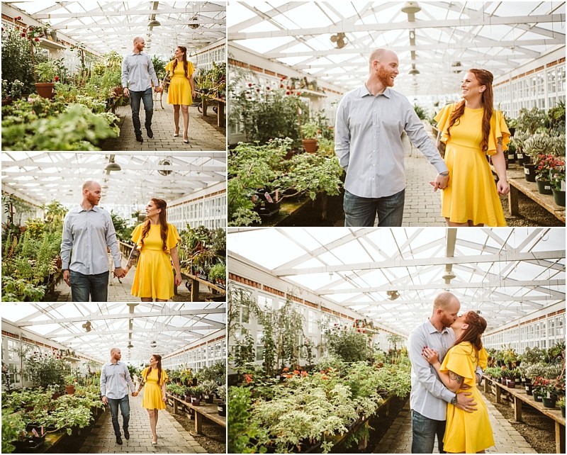 A couple enjoys time together in a snohomish greenhouse walking hand in hand and laughing The woman wears a bright yellow dress the man wears jeans and a light blue shirt Lush green plants fill the sunlit greenhouse Snohomish wedding photography