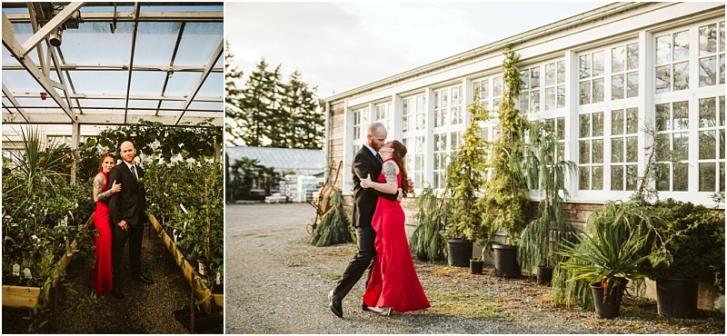 A couple dressed formally the woman in a red dress and the man in a black suit poses together inside a snohomish greenhouse and dances outside near potted plants and a large glass building Snohomish wedding photography