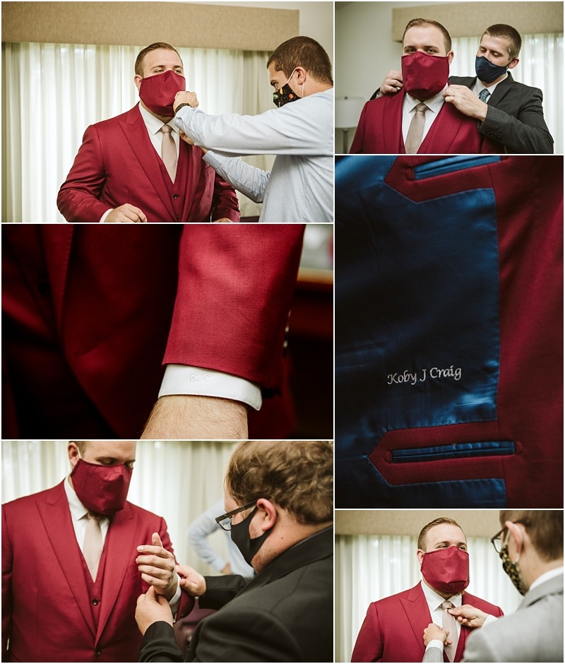 A man in a red suit and matching mask is assisted by others adjusting his mask and suit Close ups show suit details with his name koby j craig embroidered inside the jacketa stylish scene set against the backdrop of snohomish Snohomish wedding photography