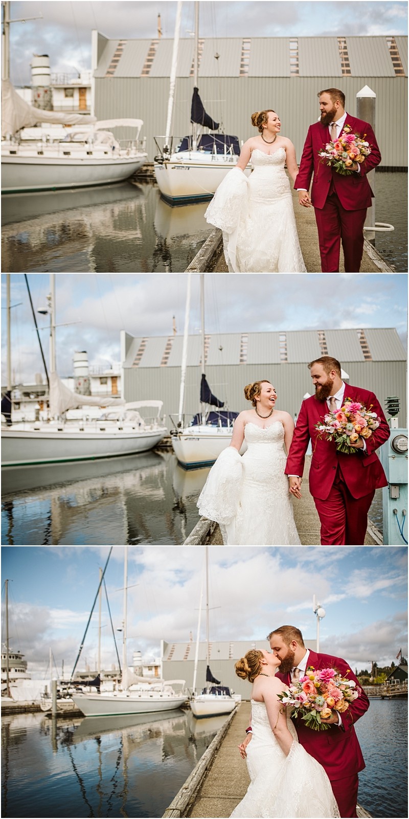A bride in a white dress and a groom in a red suit walk hand in hand by the snohomish marina smiling at each other and sharing a kiss with sailboats and sparkling water in the background Snohomish wedding photography