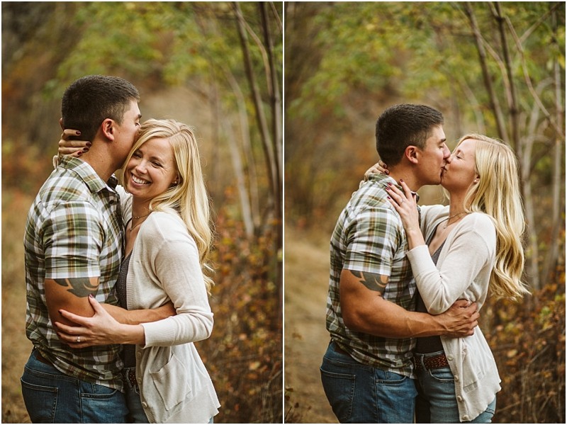 A couple stands close together outdoors among snohomish trees smiling and embracing In the left image the man kisses the womans forehead as she smiles at the camera in the right image they kiss each other on the lips Snohomish wedding photography