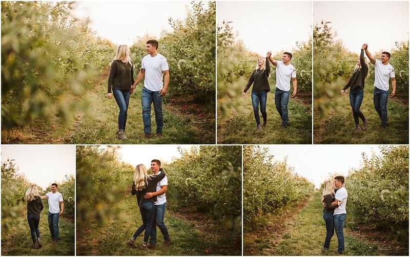 A young couple walks laughs and dances together in a snohomish orchard during sunset surrounded by green trees and grass sharing playful and affectionate moments Snohomish wedding photography