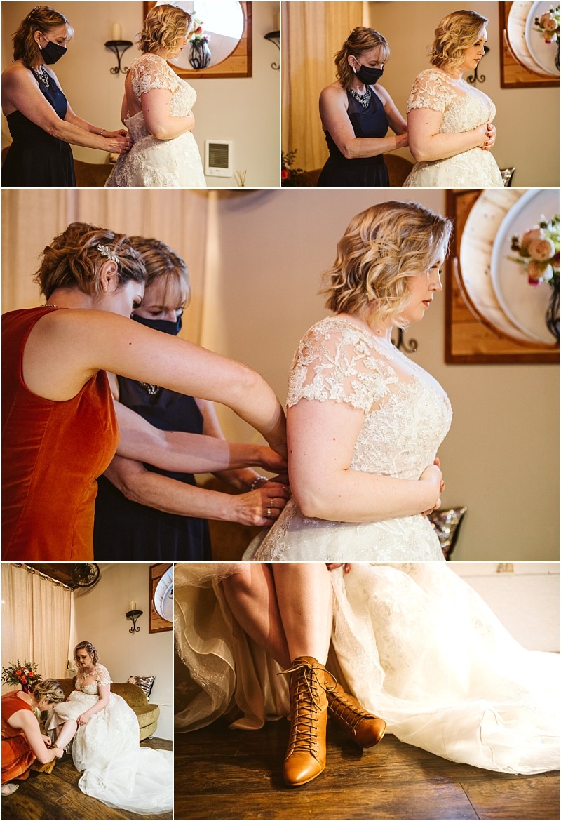 A bride in a lace wedding dress is helped by women one wearing a mask as she gets ready in snohomish She sits to put on brown lace up boots with close up shots showing the dress details and preparation process Snohomish wedding photography