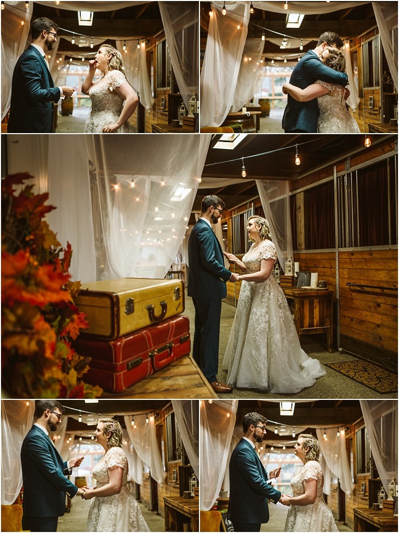 A bride and groom share an emotional first look in a rustic warmly lit snohomish venue with wooden walls draped white fabric and vintage suitcases They hold hands embrace and wipe away happy tears Snohomish wedding photography