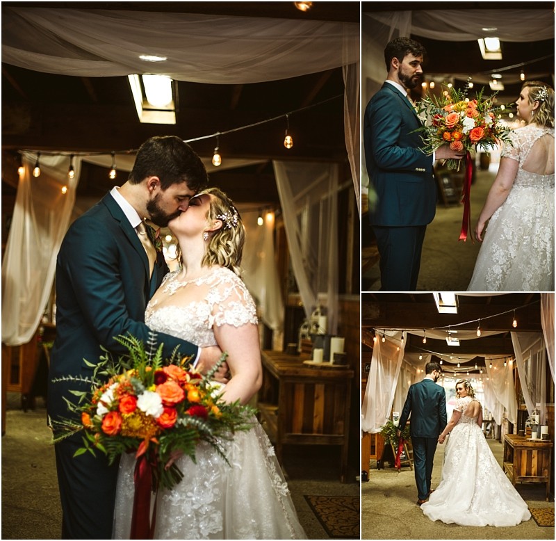 A bride and groom share a kiss and exchange smiles in a warmly lit snohomish venue decorated with draped white fabric and string lights The bride holds a vibrant bouquet of orange flowers Snohomish wedding photography