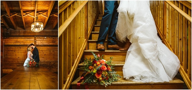 A bride and groom pose in a rustic wooden snohomish interior on the right their lower bodies are shown as they stand on wooden stairs with a colorful bouquet resting on a step Snohomish wedding photography
