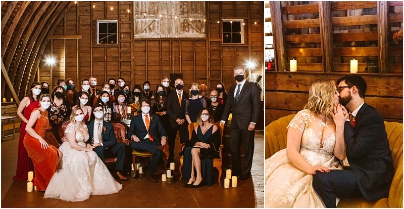 A wedding party poses indoors in snohomish most guests wearing masks The bride in a white dress and the groom in a blue suit sit together On the right a couple shares a kiss amid candles in the rustic wooden setting Snohomish wedding photography