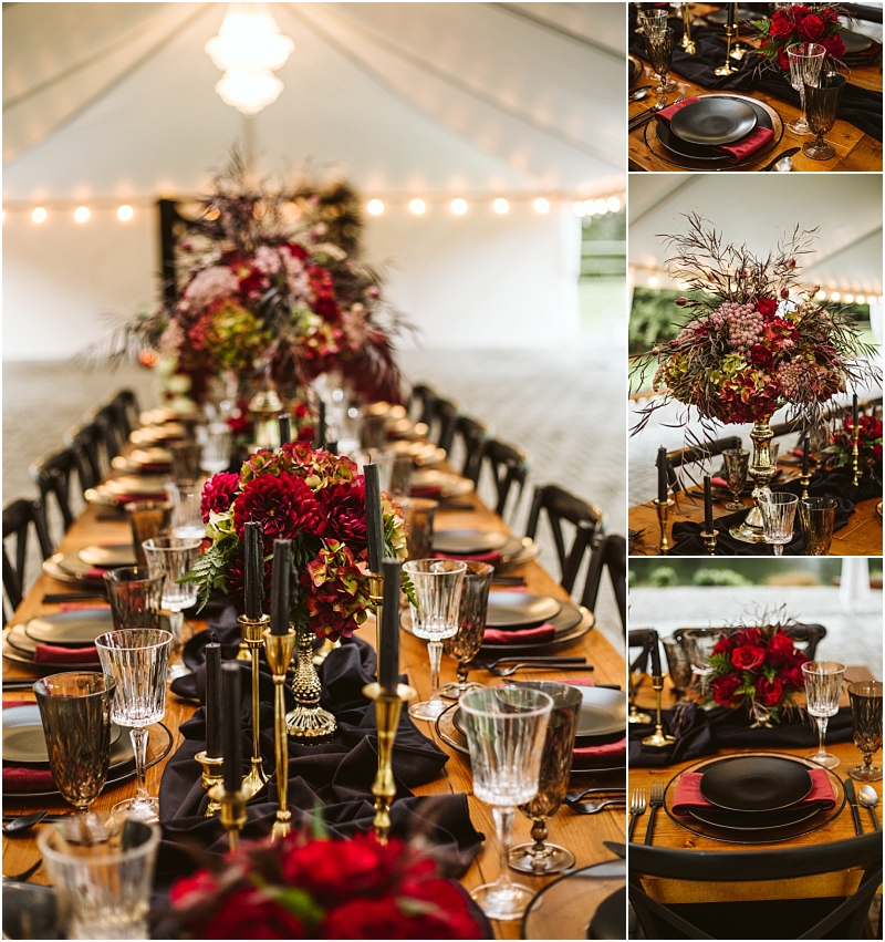 A rustic banquet table set with black plates gold flatware crystal glasses deep red floral centerpieces and black candles creates elegant décor under a white tent with string lightsa perfect snohomish event setting Snohomish wedding photography