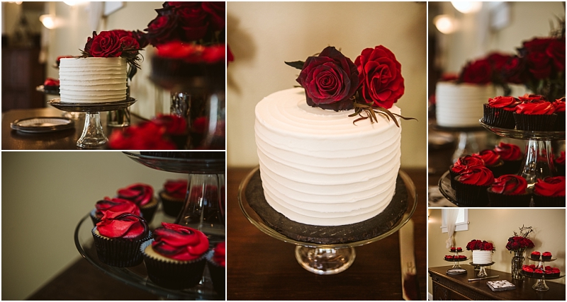 A white frosted cake with dark red roses on top is displayed on a glass stand surrounded by chocolate cupcakes with matching red rose shaped frostinga stunning centerpiece for any snohomish celebration Snohomish wedding photography