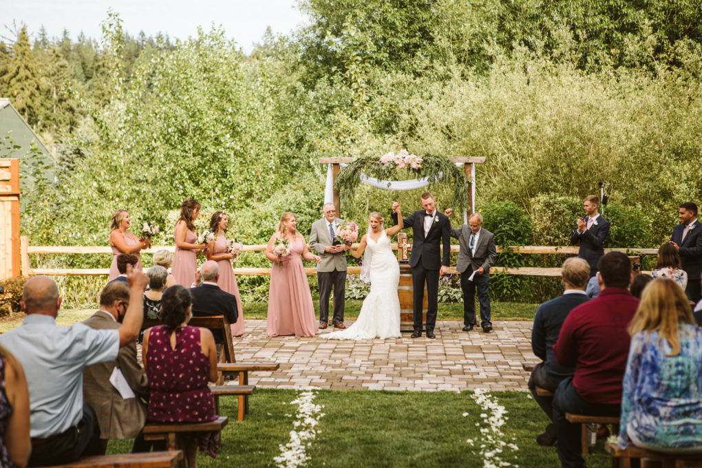COVID wedding ceremony with guests wearing a mask
