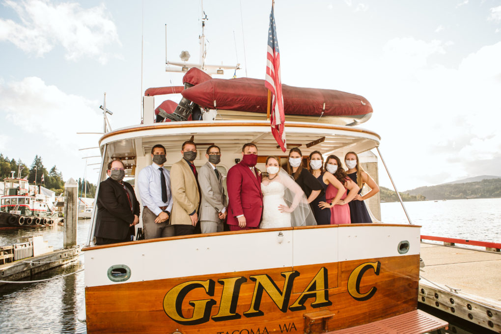 Mask wearing wedding party during a covid wedding at port orchard marina in washington state
