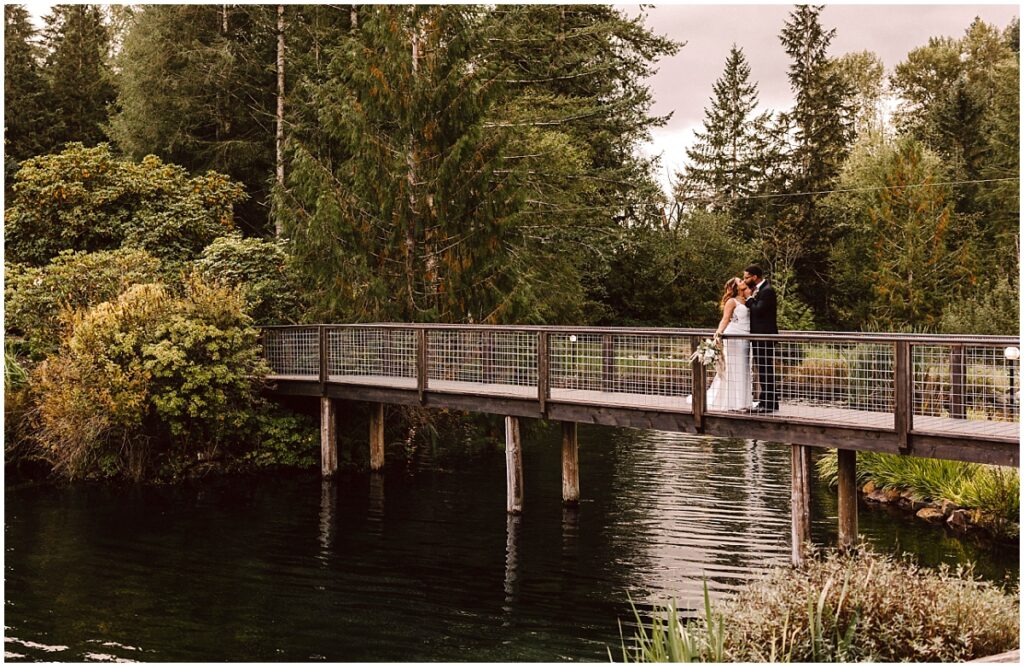 Gray bridge sultan wedding couple kissing on the gray bridge