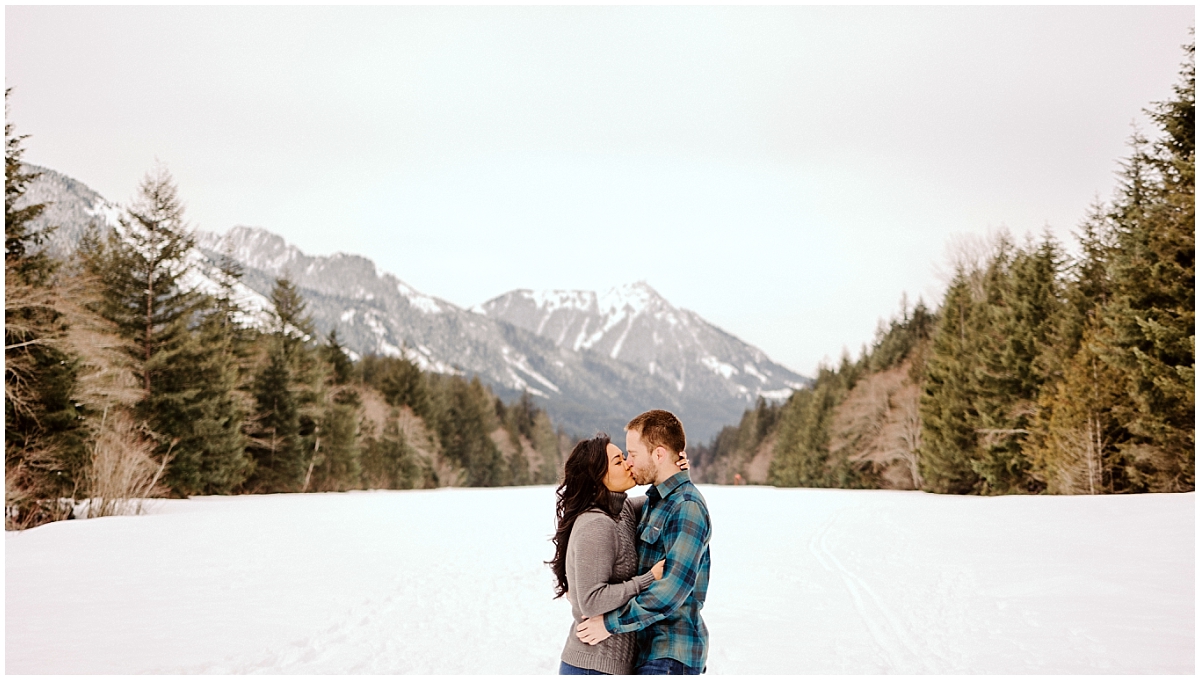 snoqualmie pass engagement session in the snow with the mountains