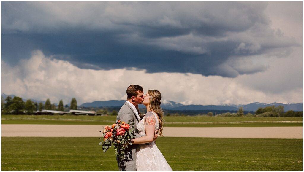 Spring hidden meadows wedding bride and groom with stormy skies in the snohomish valley in for the luv of bridal dress with flowers by flora damore Spring hidden meadows wedding bride and groom with stormy skies in the snohomish valley in for the luv of bridal dress with flowers by flora damore