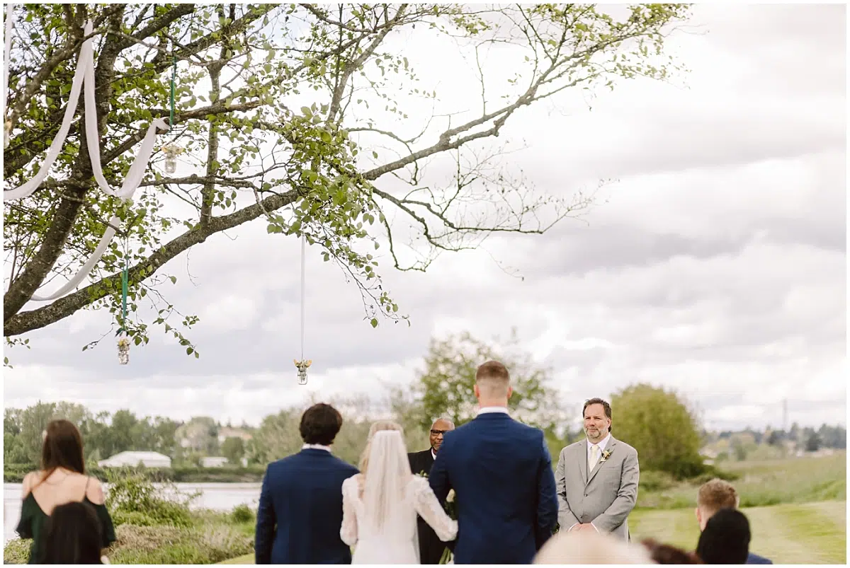 pemberton farm wedding in the spring by the snohomish river with green, gray, and yellow colors