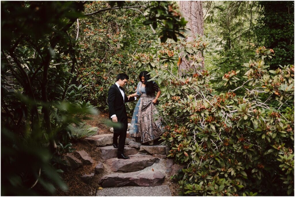 Gray bridge wedding portraits bride in a lehenga and groom in a suit in the woods Gray bridge wedding portraits bride in a lehenga and groom in a suit in the woods